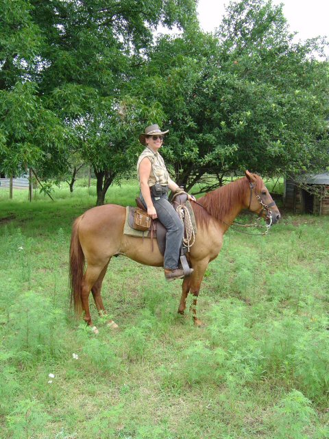 Nadine riding Peruvian Paso gelding, Che, near Seminole, OK